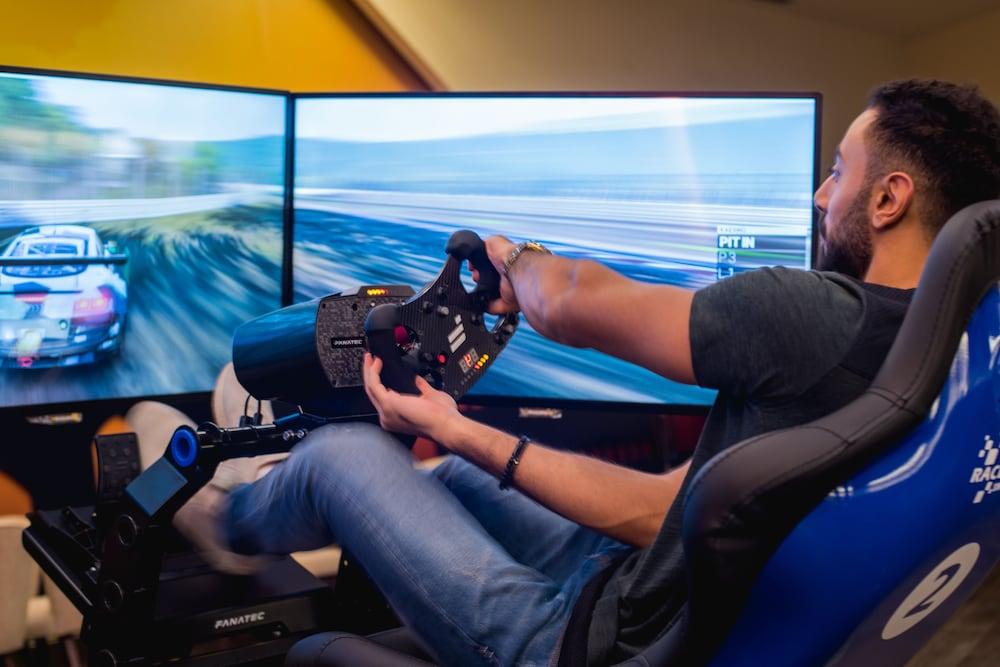 Bay La Sun Hotel And Marina - Emaar King Abdullah Economic City Exteriör bild A racing game player using a steering wheel